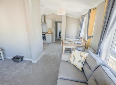 Property photo 2 of 8 Furnished Lounge And Dining Space With Large Windows