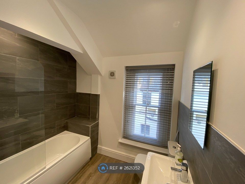 Property photo 3 of 9 Tiled Bathroom