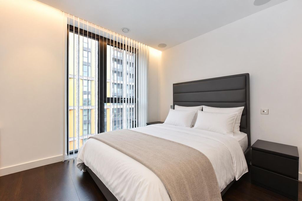 Property photo 3 of 11 Tidy Bedroom With Crisp White Bedding.Png