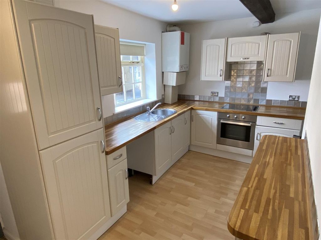 Property photo 2 of 6 Bright Kitchen With Ample Wood-Effect Workspace...