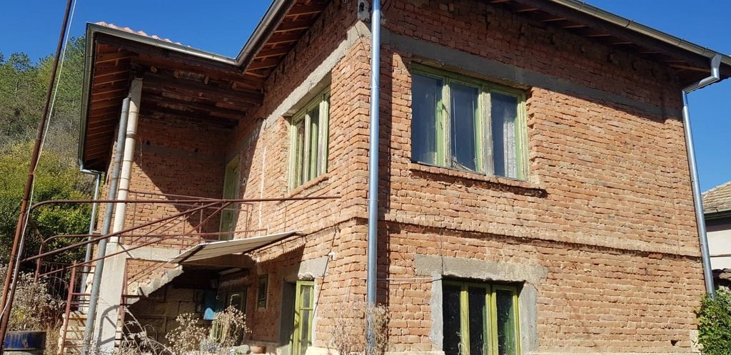 Property photo 3 of 73 Close-Up Showing The Corner Of The Brick House With An External Metal Staircase And Green Window Frames
