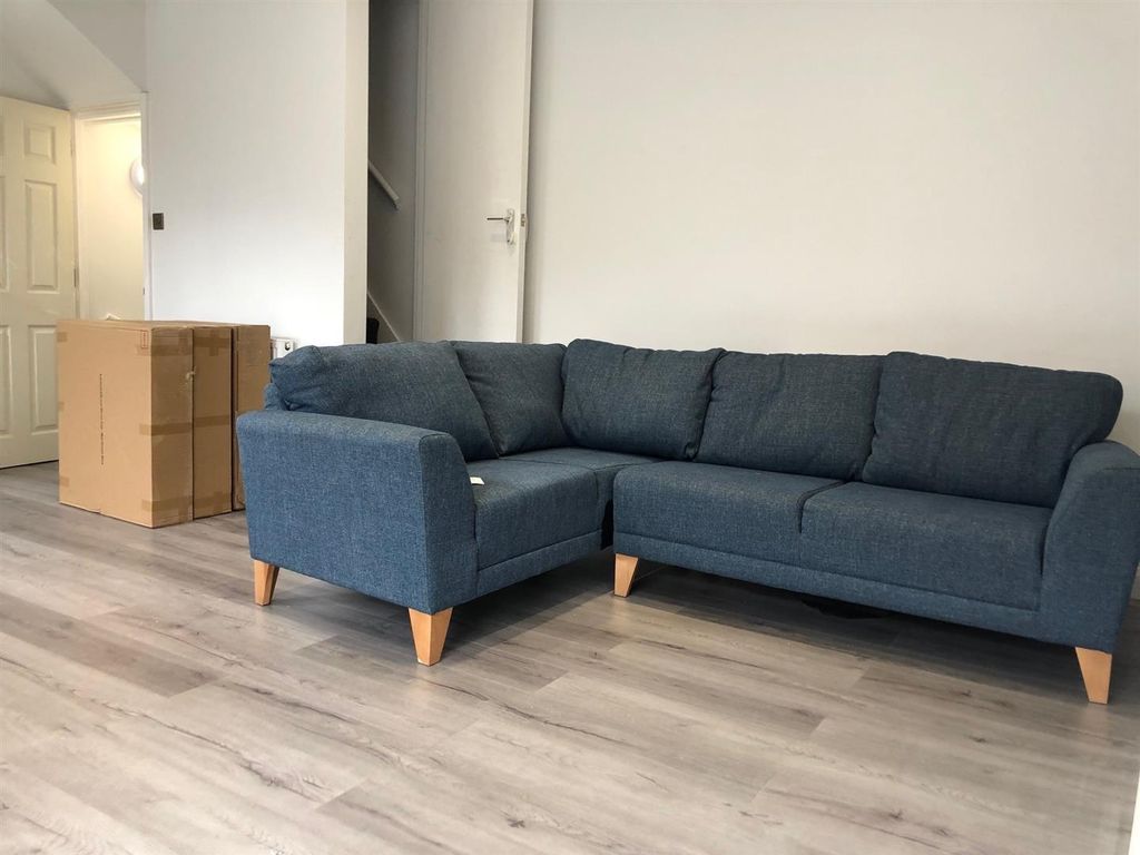 Property photo 1 of 7 A Spacious And Modern Living Room Featuring A Larg...