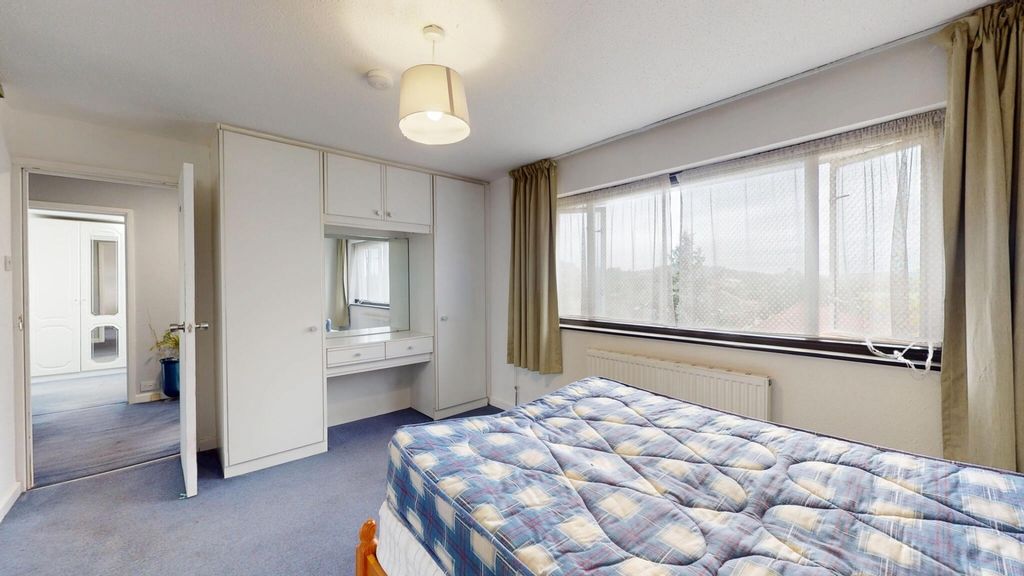 Property photo 1 of 12 Spacious Master Bedroom Featuring A Large Bed, Amp...