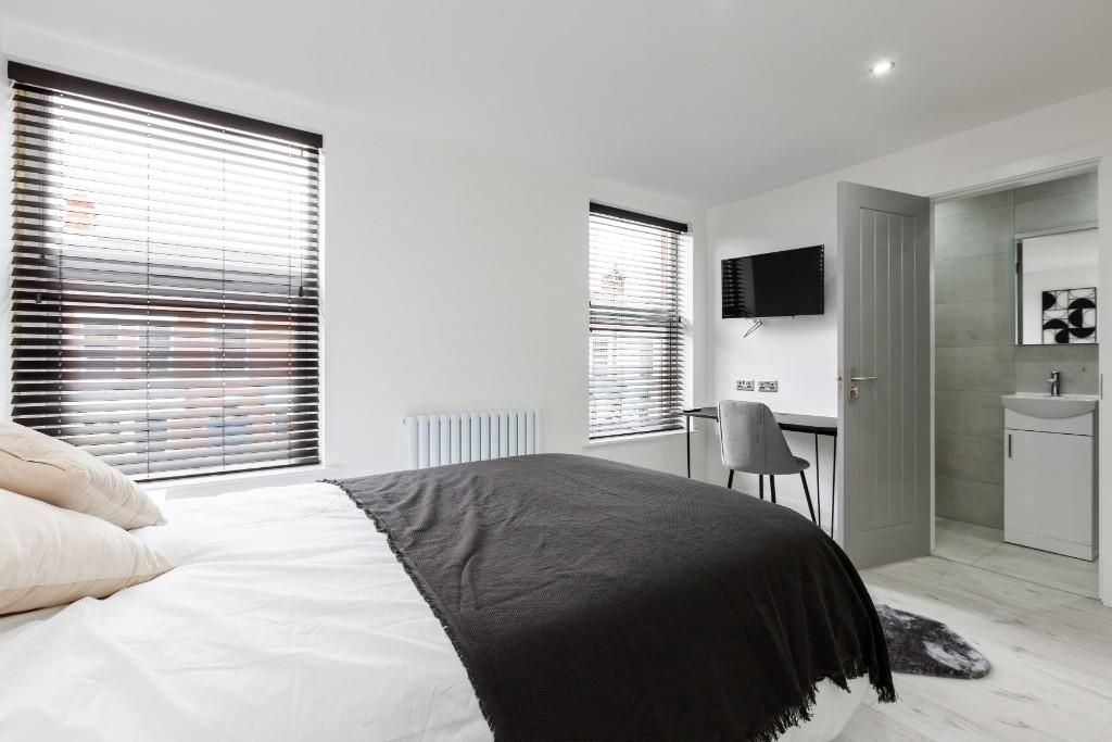 Property photo 2 of 10 A Spacious, Well-Lit Master Bedroom With Large Win...