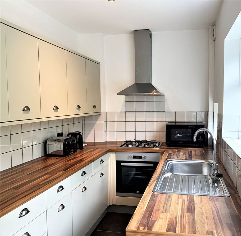 Property photo 3 of 18 Bright Modern Galley Kitchen With Wood-Effect Work...