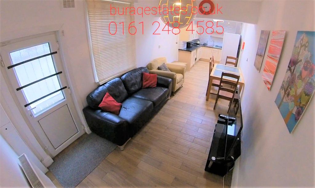 Property photo 3 of 8 Bright And Cozy Living Room Featuring A Comfortabl...