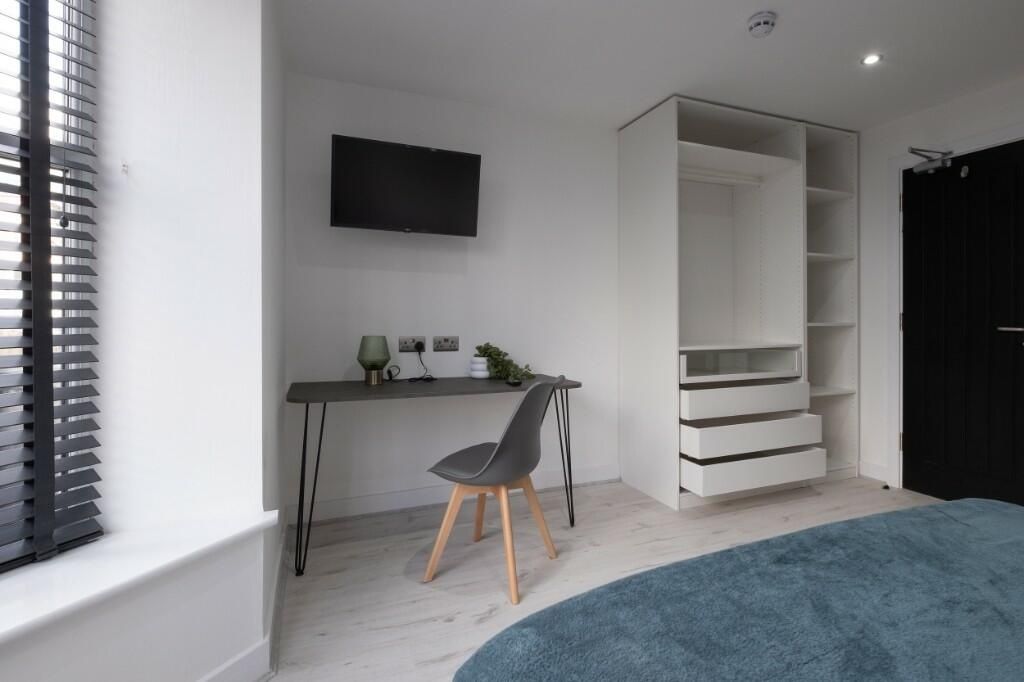 Property photo 1 of 15 Bright, Modern Bedroom With Light Wood Floors, A W...