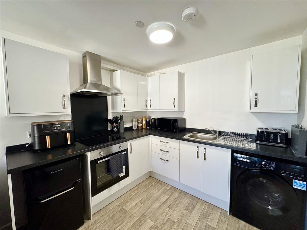 Property photo 3 of 12 Kitchen Area