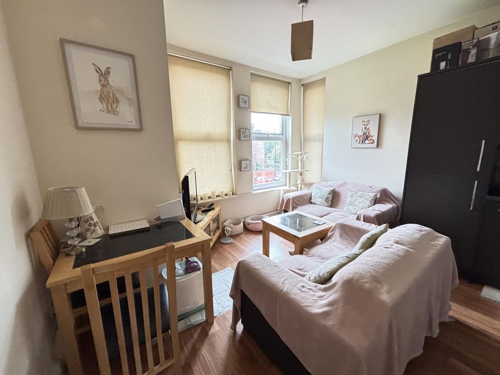 Property photo 2 of 12 A Bright And Inviting Living Room Filled With Natu...