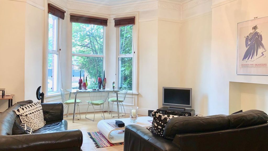 Property photo 1 of 14 A Bright And Welcoming Living Room Featuring Large...