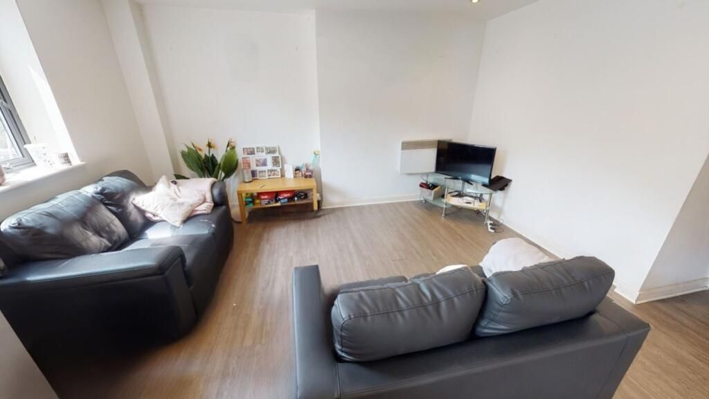 Property photo 2 of 6 A Bright And Tidy Living Room Featuring Modern Lea...