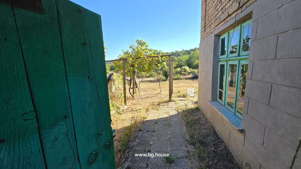 Property photo 3 of 90 Green Wooden Gate Partially Open Showing Paved Path, Grapevine Trellis, And Garden Area With Trees And Bushes