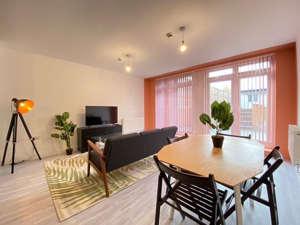 Property photo 1 of 33 Bright And Modern Living Room Featuring A Comforta...