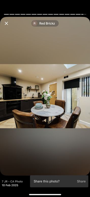 Property photo 2 of 6 Modern Kitchen With Sleek Black Cabinetry, A Styli...