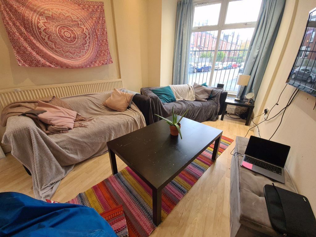 Property photo 2 of 18 Bright And Welcoming Living Room Featuring A Large...