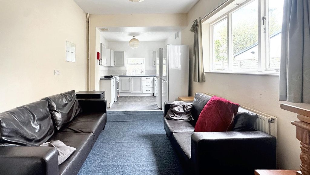 Property photo 1 of 6 Bright, Open-Plan Living Area With Two Black Leath...