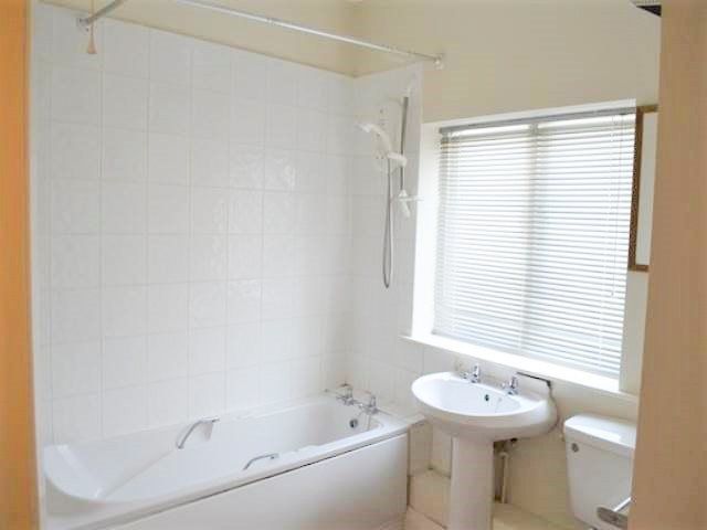 Property photo 1 of 5 A Bright And Clean Bathroom Featuring A Modern Whi...