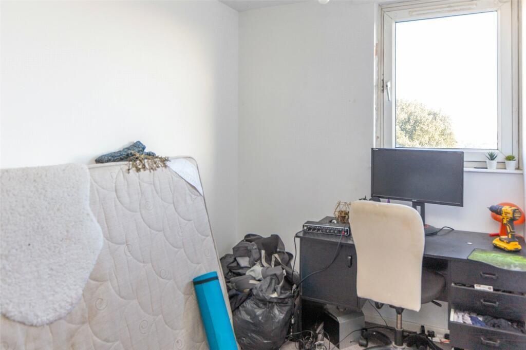 Property photo 1 of 7 A Cozy Bedroom Featuring A Bed With A Padded Headb...