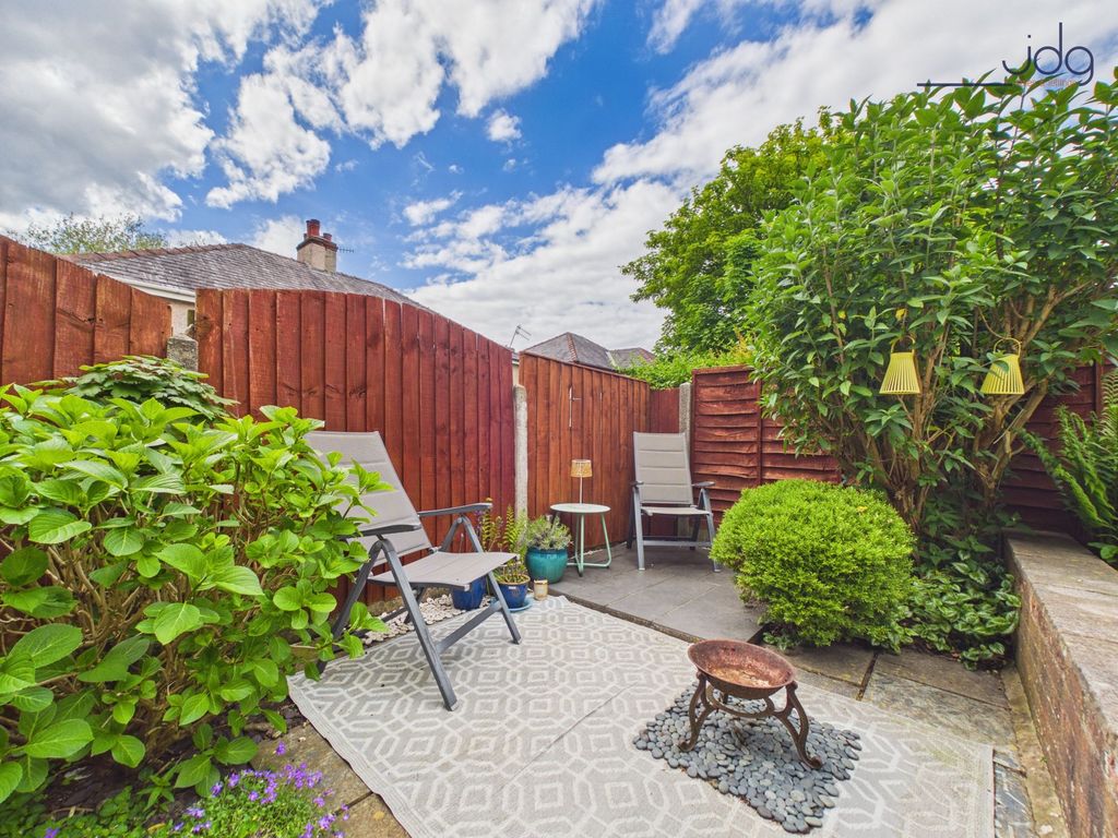 Property photo 3 of 15 Tiered Garden With A Mixture Of Flags, Decking And Lawn.