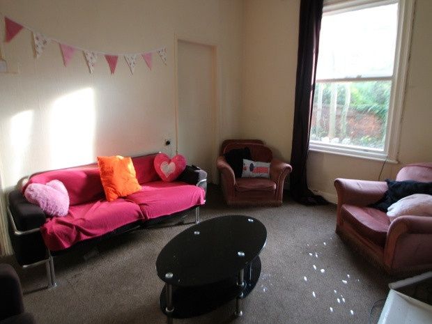 Property photo 2 of 14 A Bright And Welcoming Living Room Featuring Comfo...