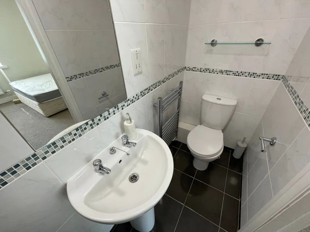 Property photo 2 of 13 Bright And Clean Small Toilet Room Featuring Moder...