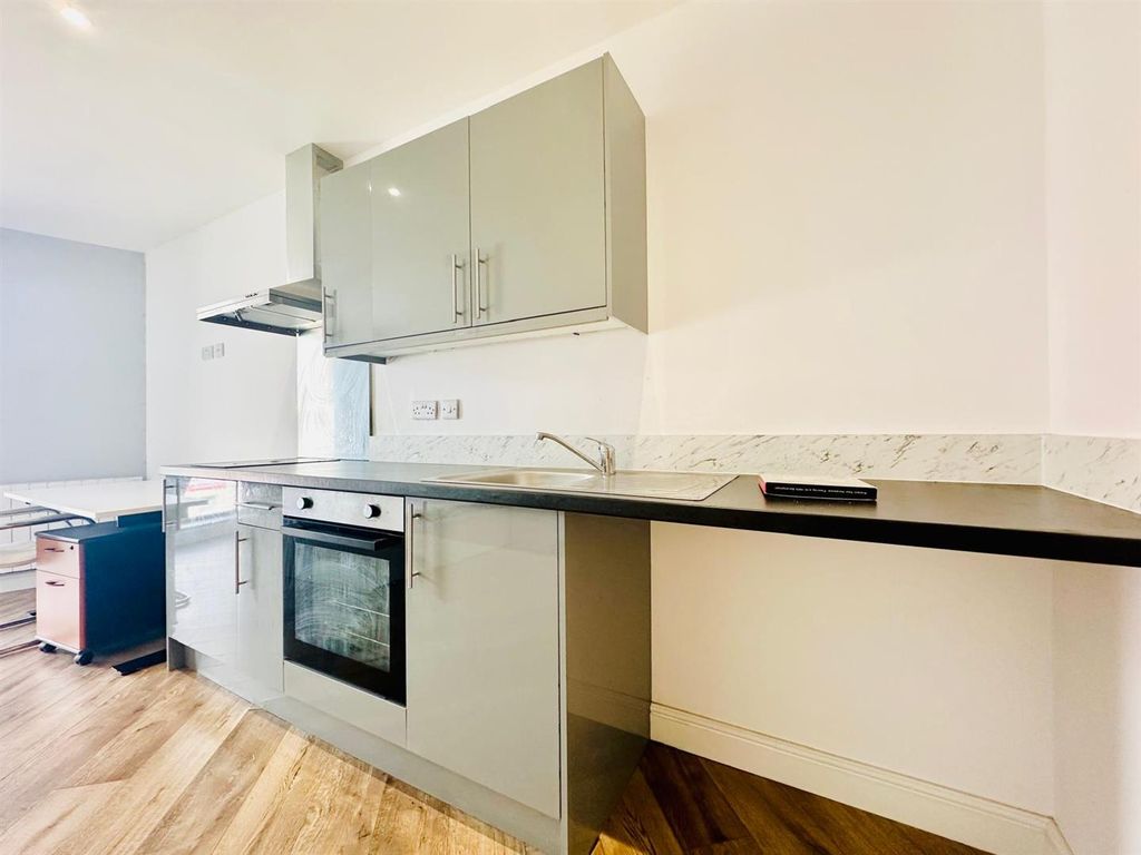 Property photo 1 of 6 Kitchen Area