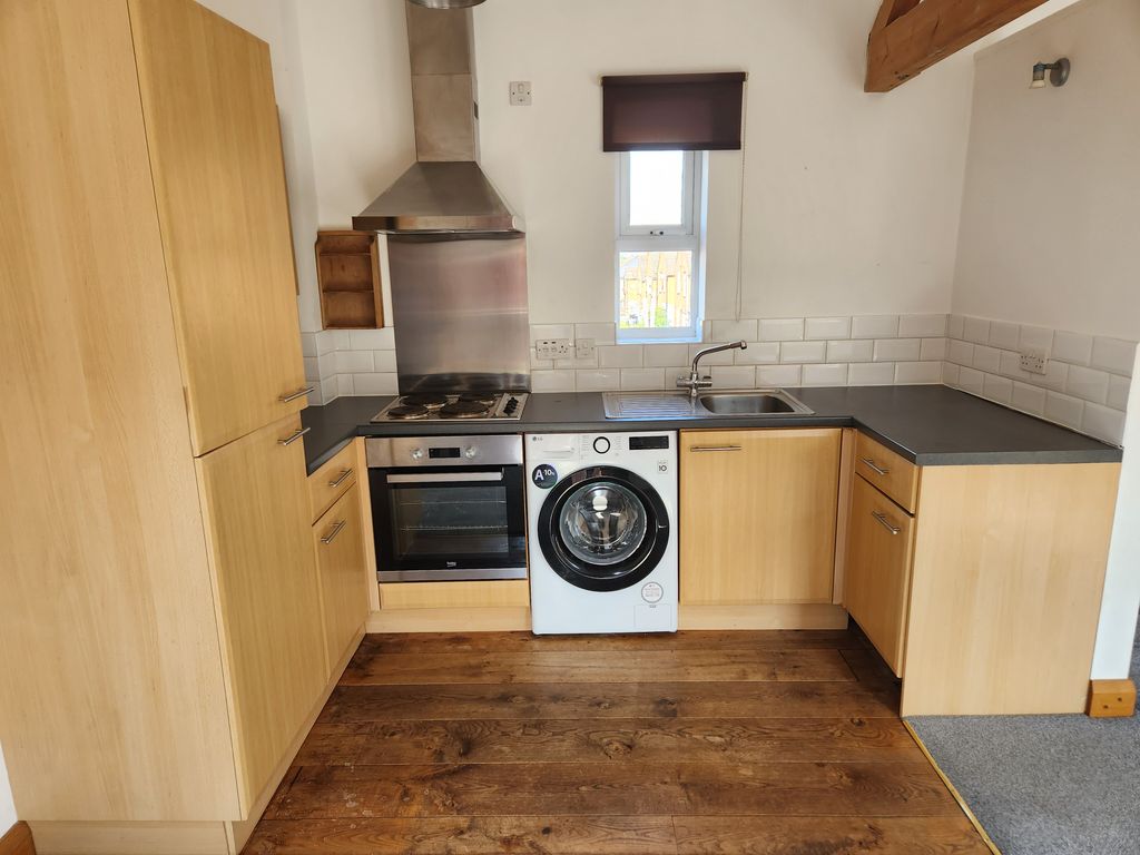 Property photo 2 of 8 Kitchen Area