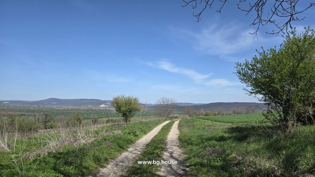 Property photo 3 of 82 Dirt Road Surrounded By Green Fields And Trees, Extending Towards Distant Hills Under A Blue Sky