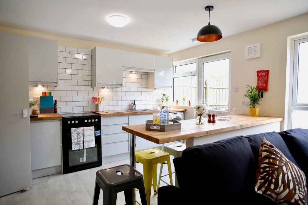 Property photo 3 of 5 Bright Modern Kitchen With White Cabinetry, Subway...
