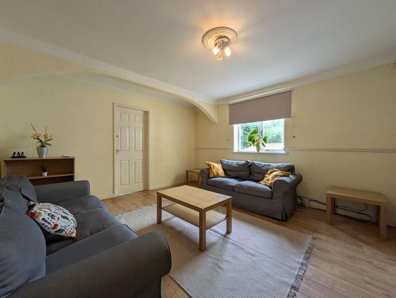 Property photo 3 of 14 A Cozy Living Room Featuring Comfortable Sofas, A ...