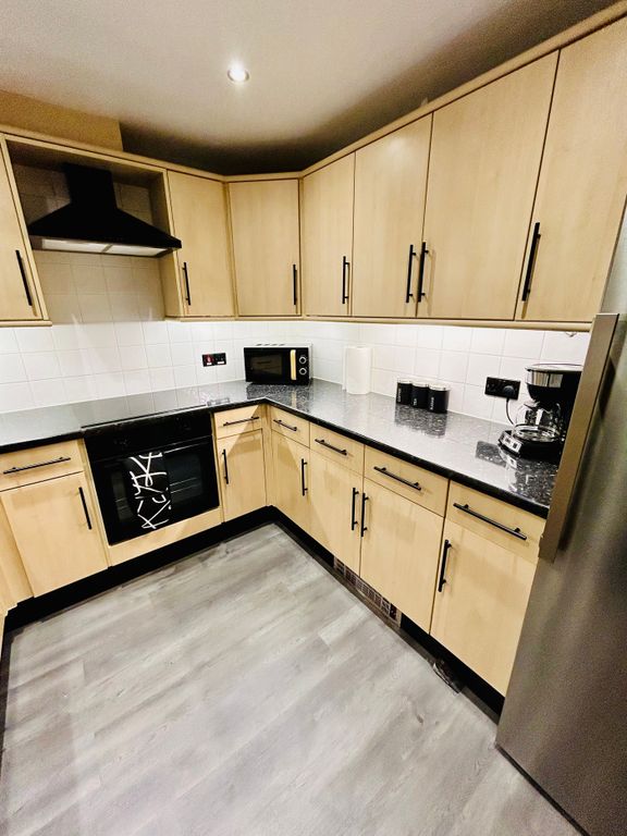Property photo 2 of 11 A Modern And Clean Kitchenette With Ample Storage ...