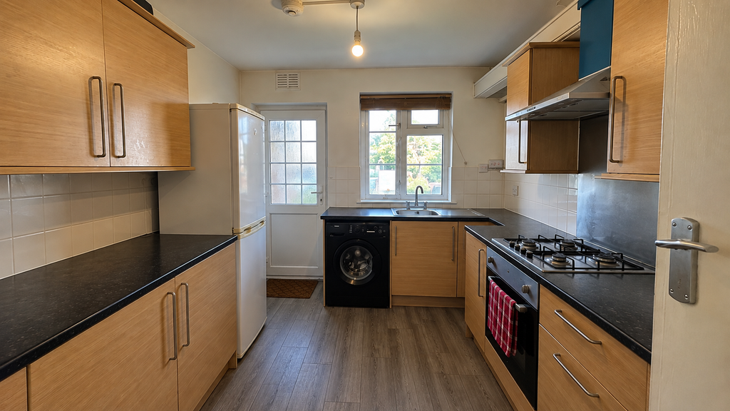 Property photo 2 of 9 Tidy Natural Galley Kitchen