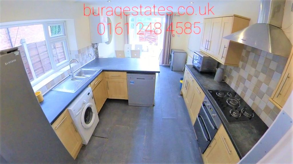 Property photo 1 of 15 Bright And Modern Kitchen Featuring Ample Natural ...