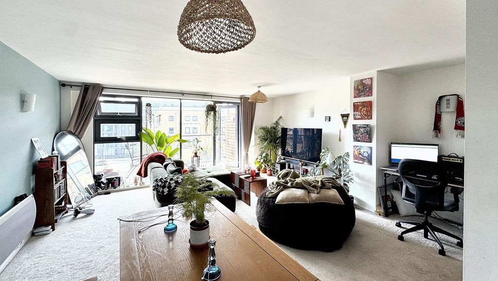 Property photo 1 of 11 A Bright And Spacious Living Room Featuring Large ...