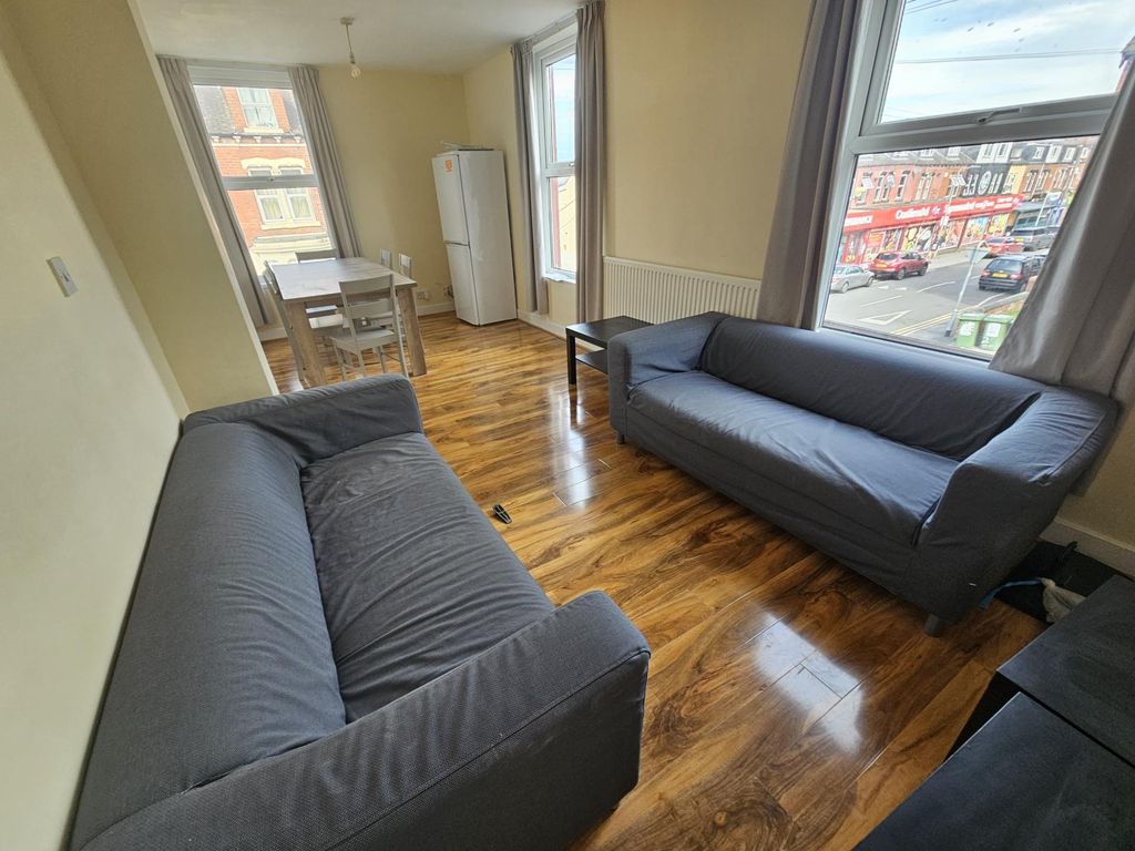 Property photo 1 of 20 Bright And Welcoming Living Room Featuring Two Com...