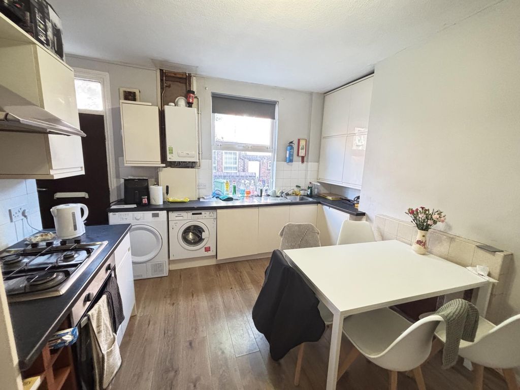 Property photo 2 of 19 A Bright, Modern Living Room Featuring A Cozy Atmo...