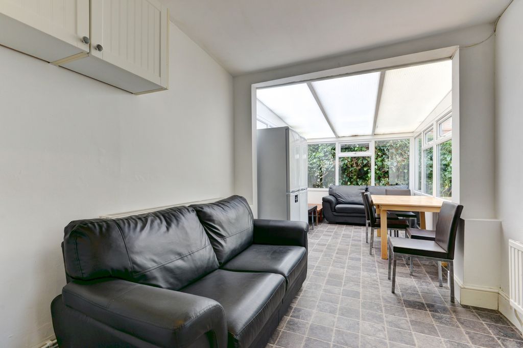 Property photo 2 of 16 Bright And Welcoming Living Room Featuring A Comfo...