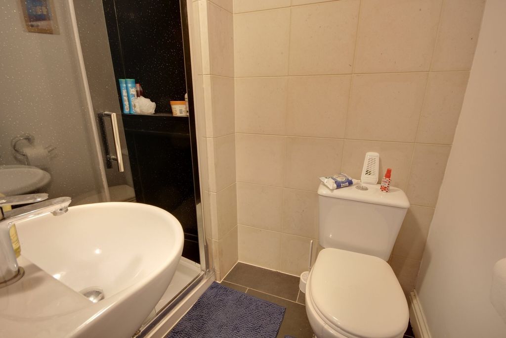Property photo 1 of 13 A Modern Bathroom Featuring A Shower And Stylish F...