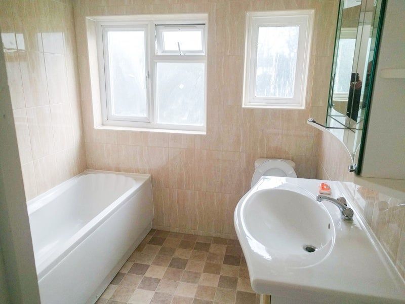 Property photo 2 of 5 Bright And Clean Bathroom Suite Featuring A Modern...