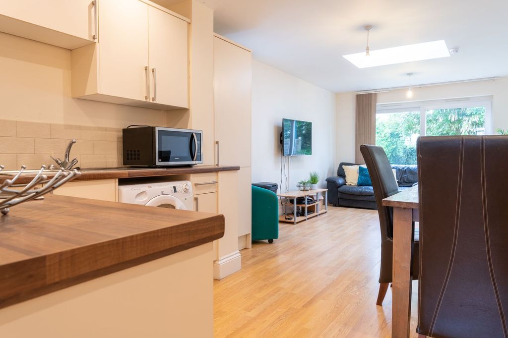 Property photo 2 of 11 Bright Open-Plan Living And Kitchen Area With Wood...