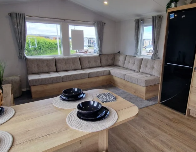 Property photo 2 of 10 Bright Open Plan Lounge With Spacious Corner Seating And Dining Table