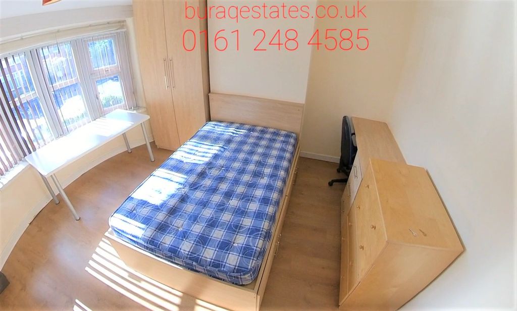 Property photo 3 of 13 A Cozy Single Bedroom Featuring A Neatly Made Bed ...