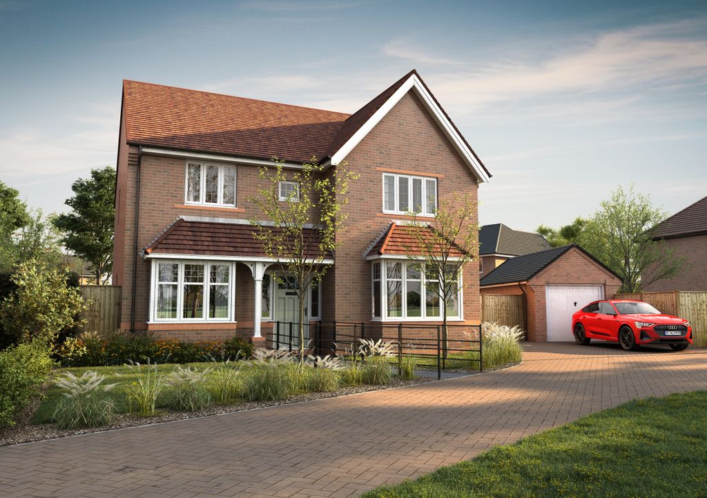 Property photo 1 of 11 A Red Car Is Parked On A Brick Driveway In Front Of A Two-Story Brick House Surrounded By Green Foli