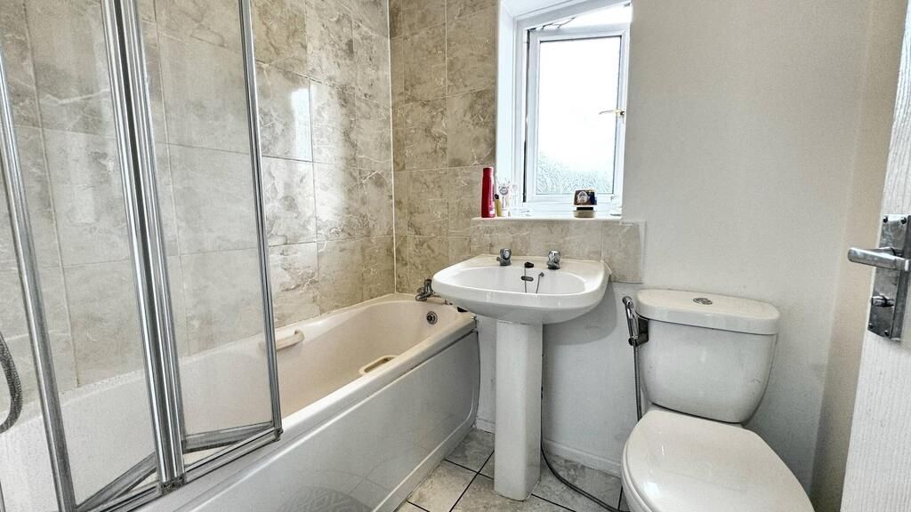 Property photo 2 of 13 Bright Bathroom With Elegant Marble Tiling...