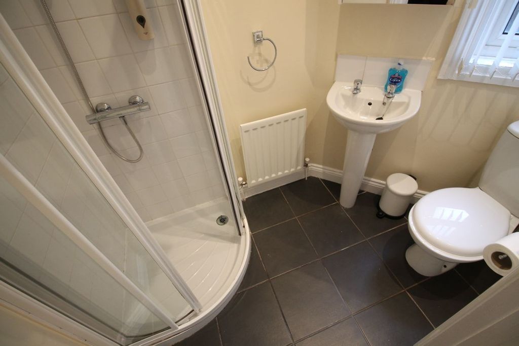 Property photo 3 of 15 A Modern Bathroom Featuring A Stylish Shower, Slee...