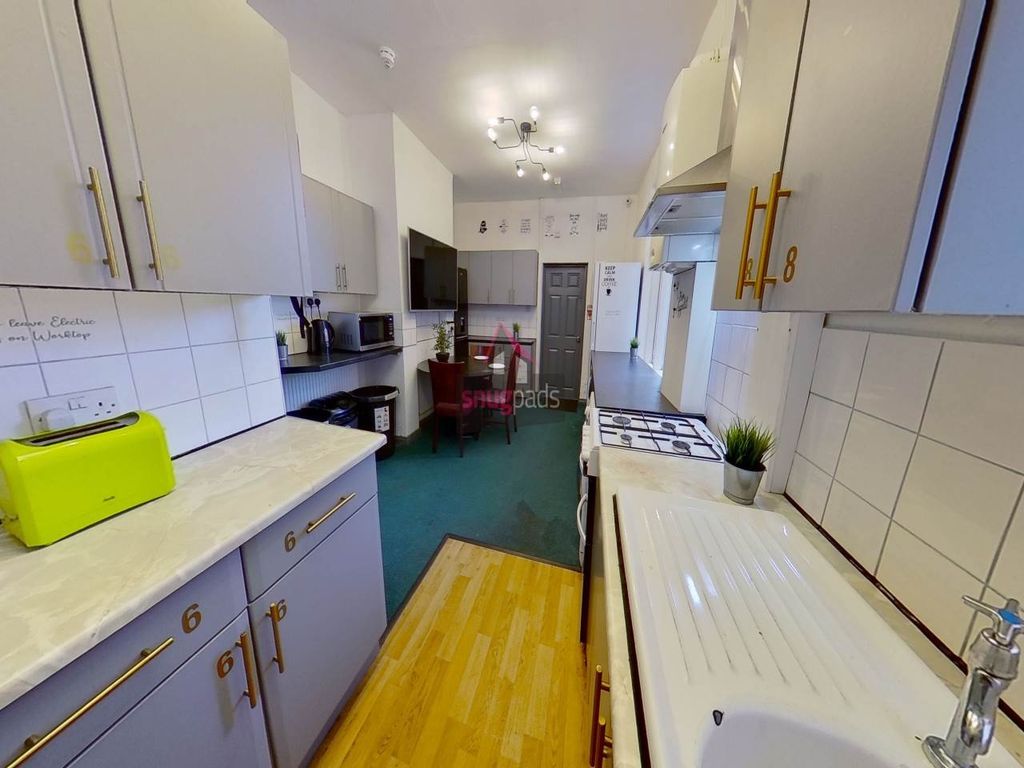 Property photo 3 of 8 Bright And Functional Kitchen Featuring Ample Coun...