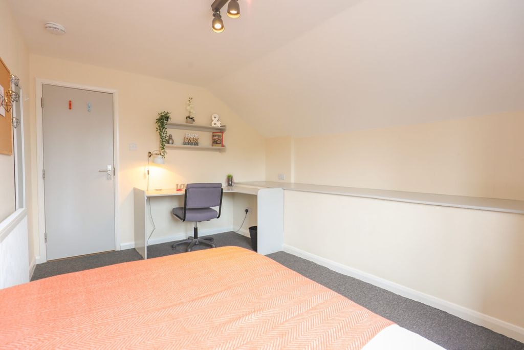 Property photo 3 of 6 A Bright And Welcoming Bedroom Featuring A Neatly ...