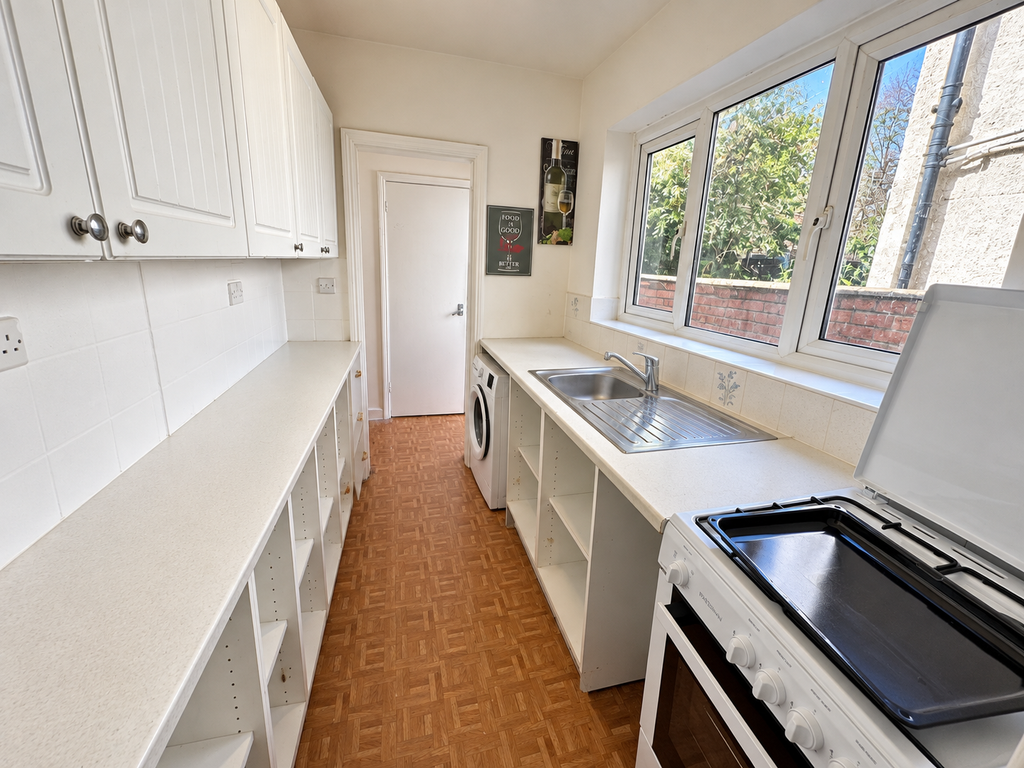Property photo 2 of 9 Bright Galley Kitchen Interior
