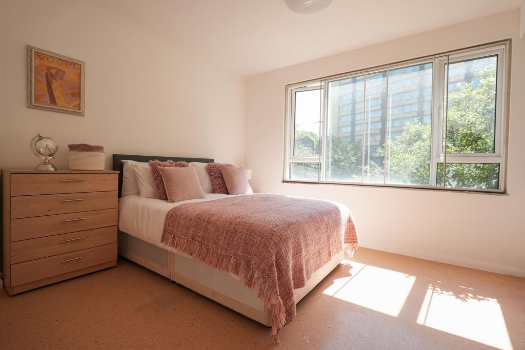 Property photo 3 of 13 Bright And Inviting Double Bedroom Featuring A Lar...
