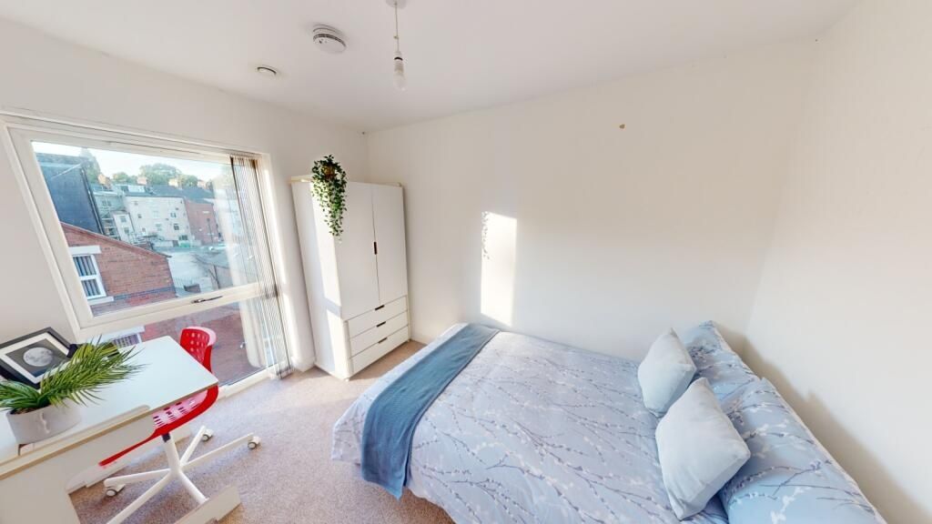 Property photo 1 of 11 Bright And Inviting Master Bedroom Featuring A Com...